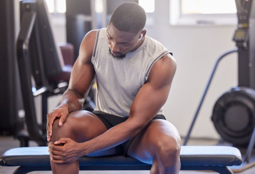 Person training with weights during a gym-based rehab session